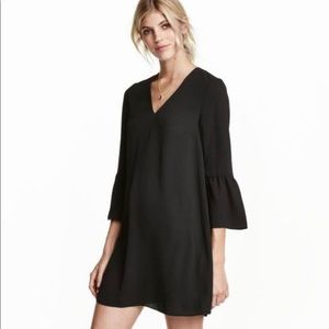 H&M flared V-neck dress with trumpet/bell sleeves.